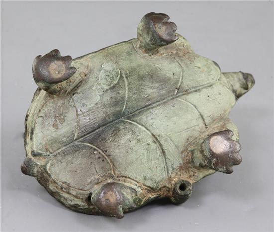 A Chinese archaic bronze tortoise lamp base, probably Six Dynasties, 4th-5th century A.D. 15.5cm long, 9cm high, restoration to head